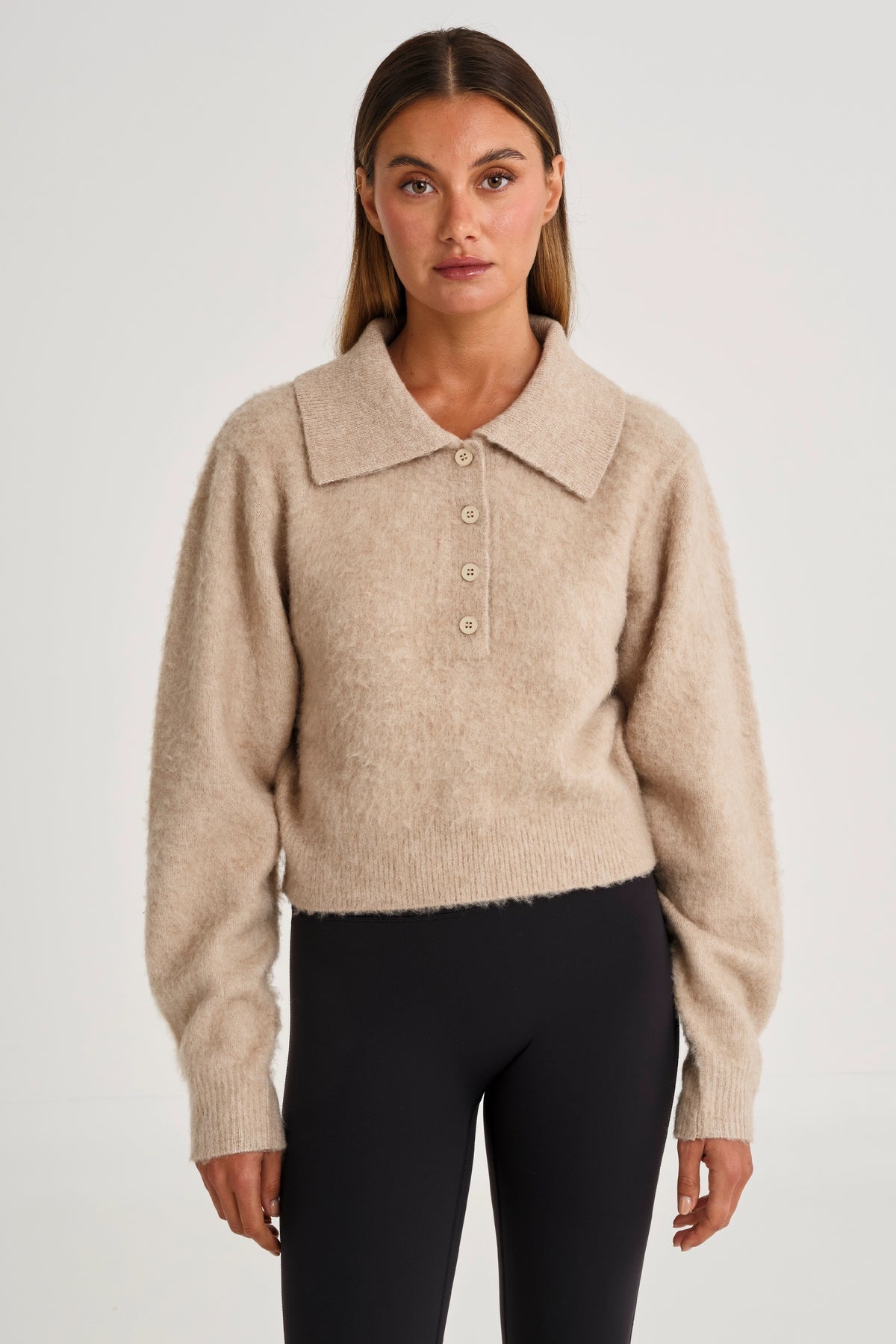Woman wearing a beige sweater 