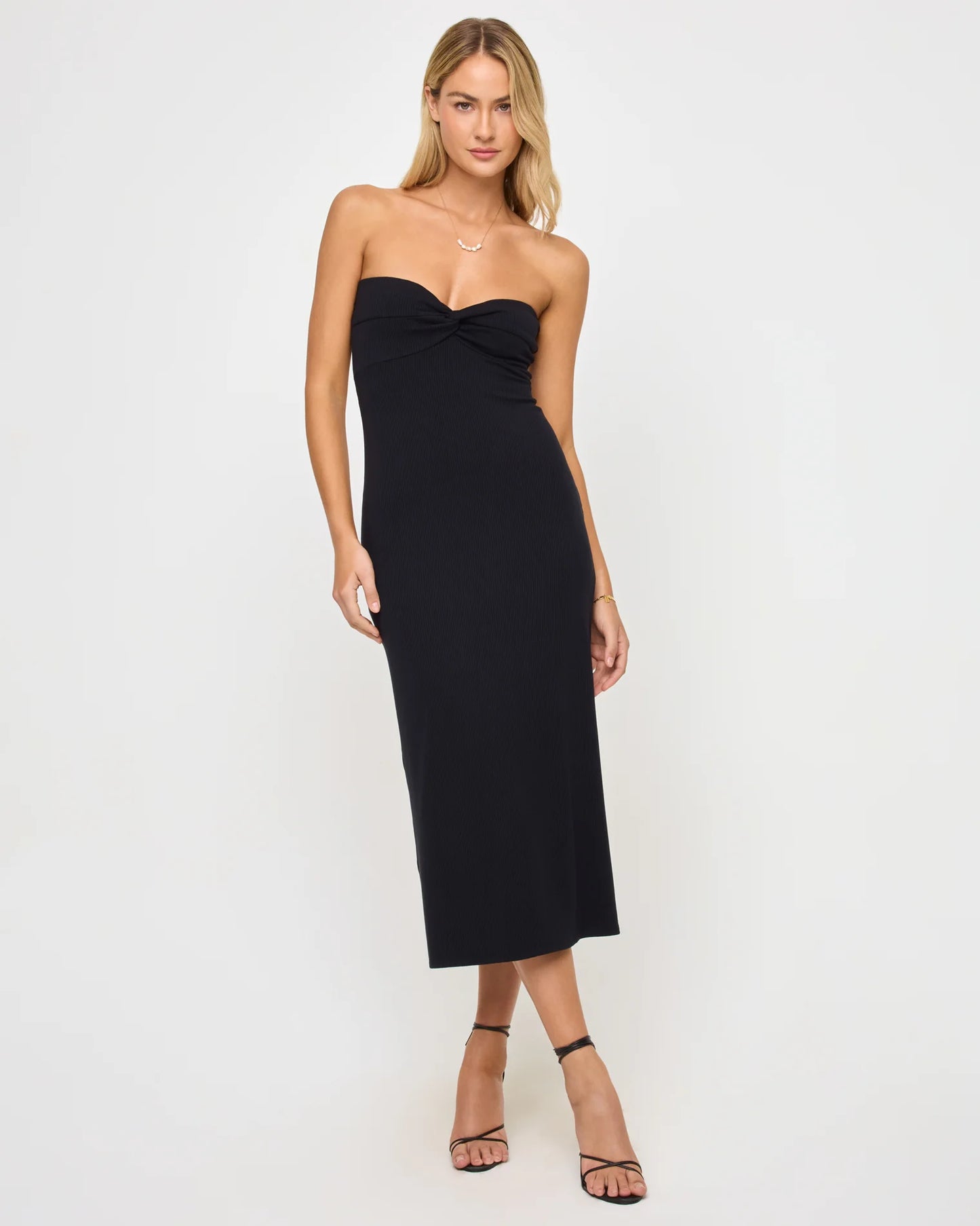 Woman wearing a black strapless dress 