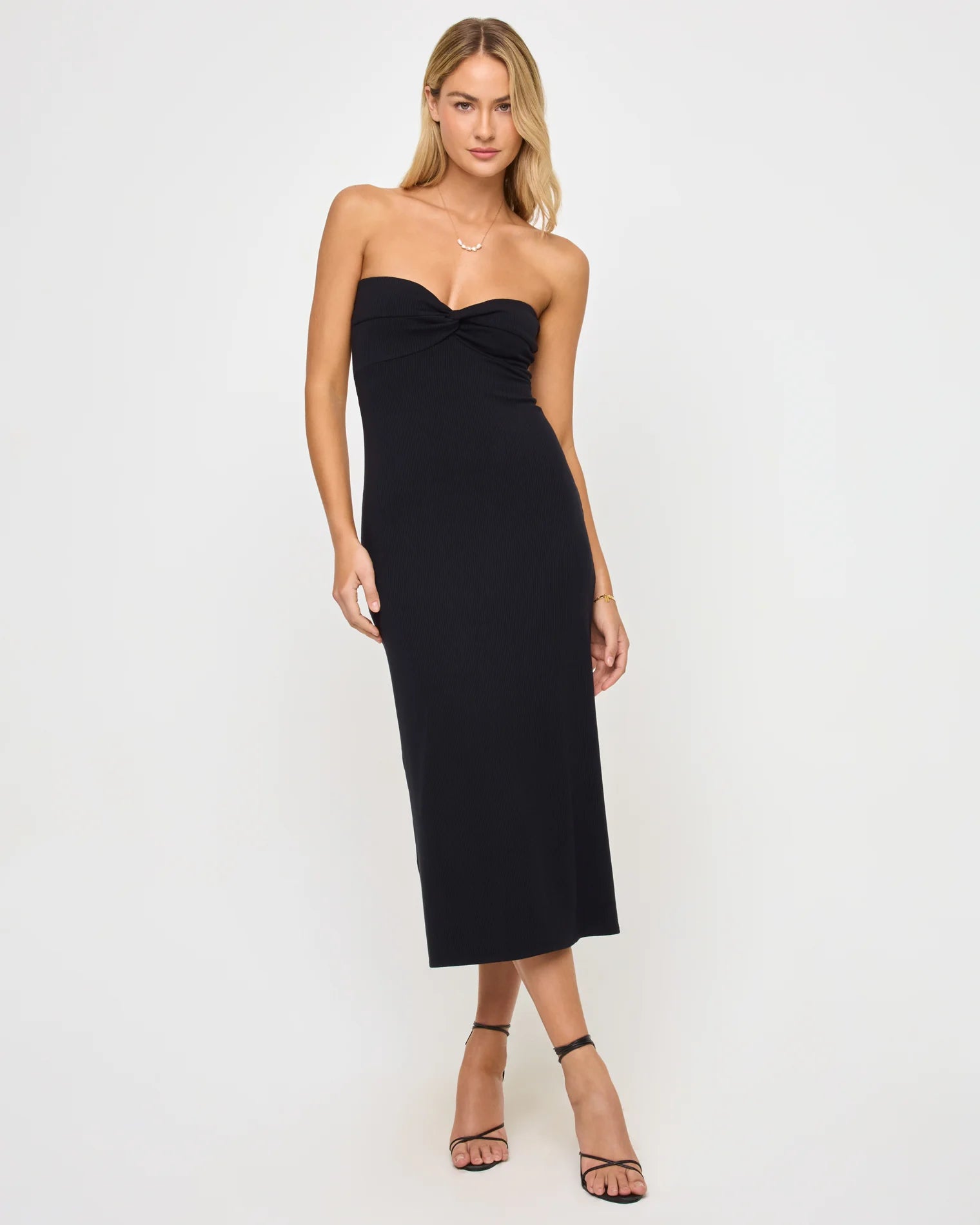 Woman wearing a black strapless dress 