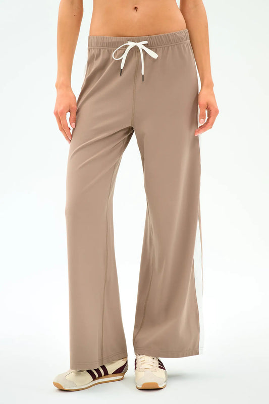 Beige lounge pants worn by a person