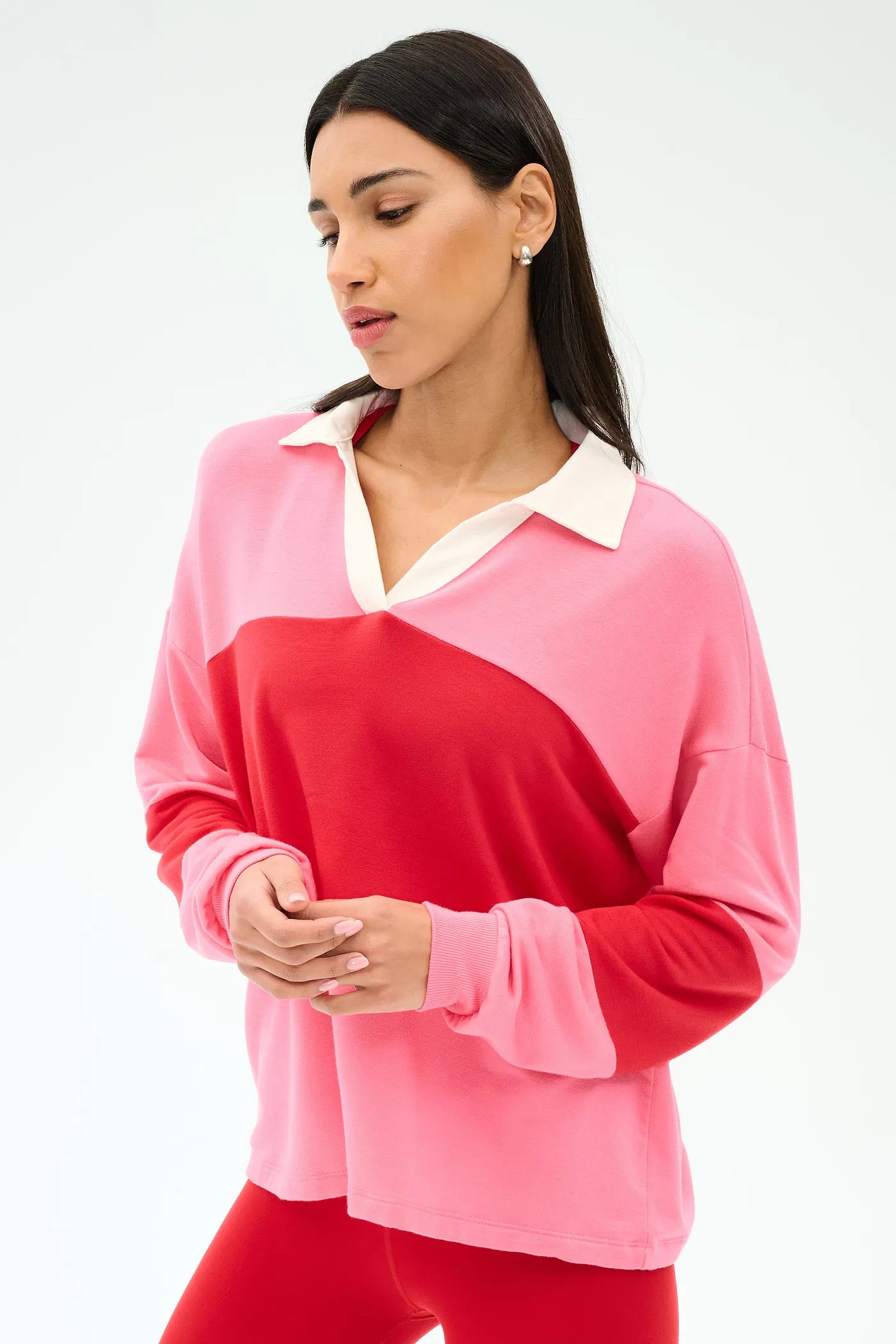 Woman wearing a pink and red color-blocked long-sleeve top