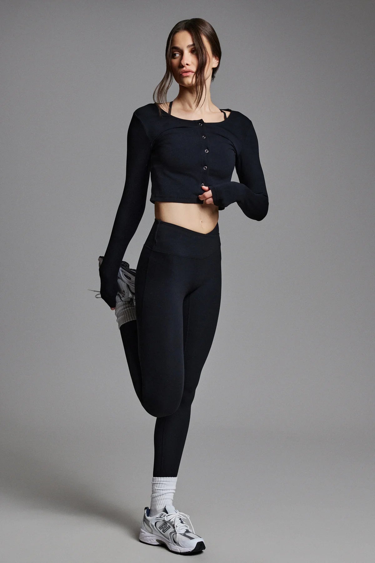 Woman in black athletic outfit 