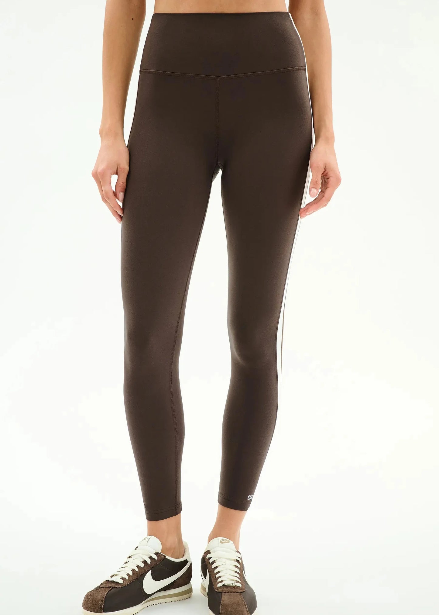 Person wearing brown leggings